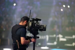 Camera operator filming on stage