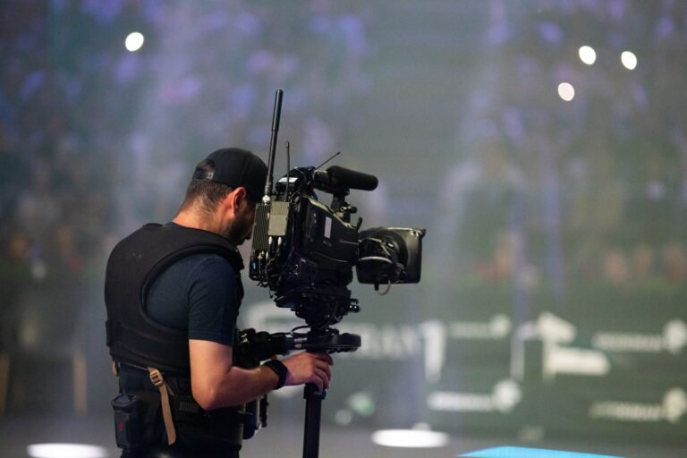 Camera operator filming on stage