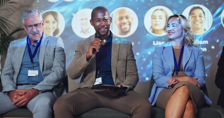 Three panelists, one speaking into a mic