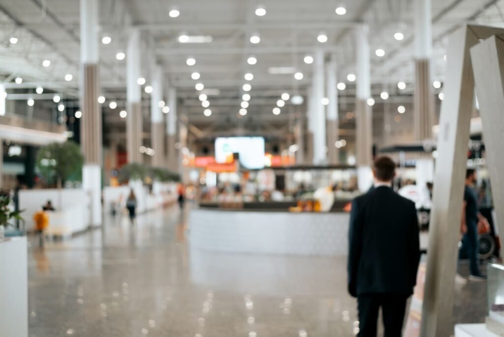 Attendee walking into a bright expo hall