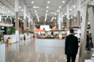 Attendee walking into a bright expo hall