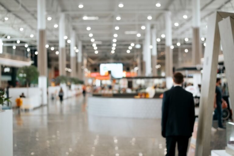 Attendee walking into a bright expo hall
