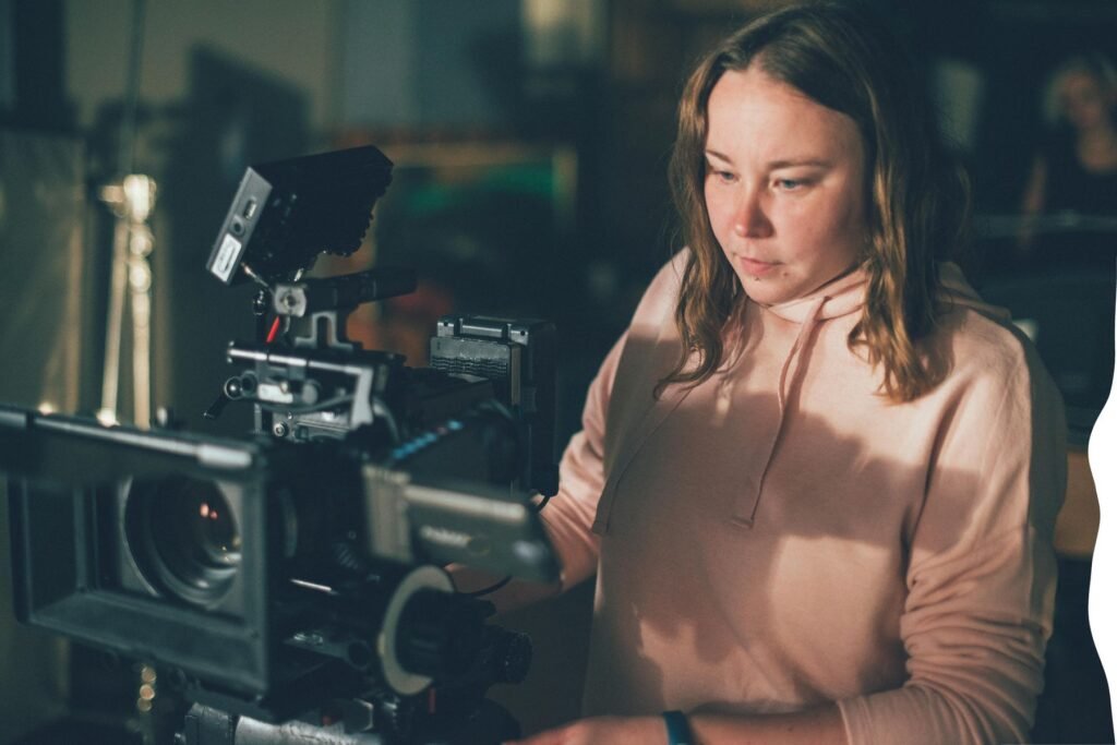 Joshna behind a cinema camera (stand-in photo)